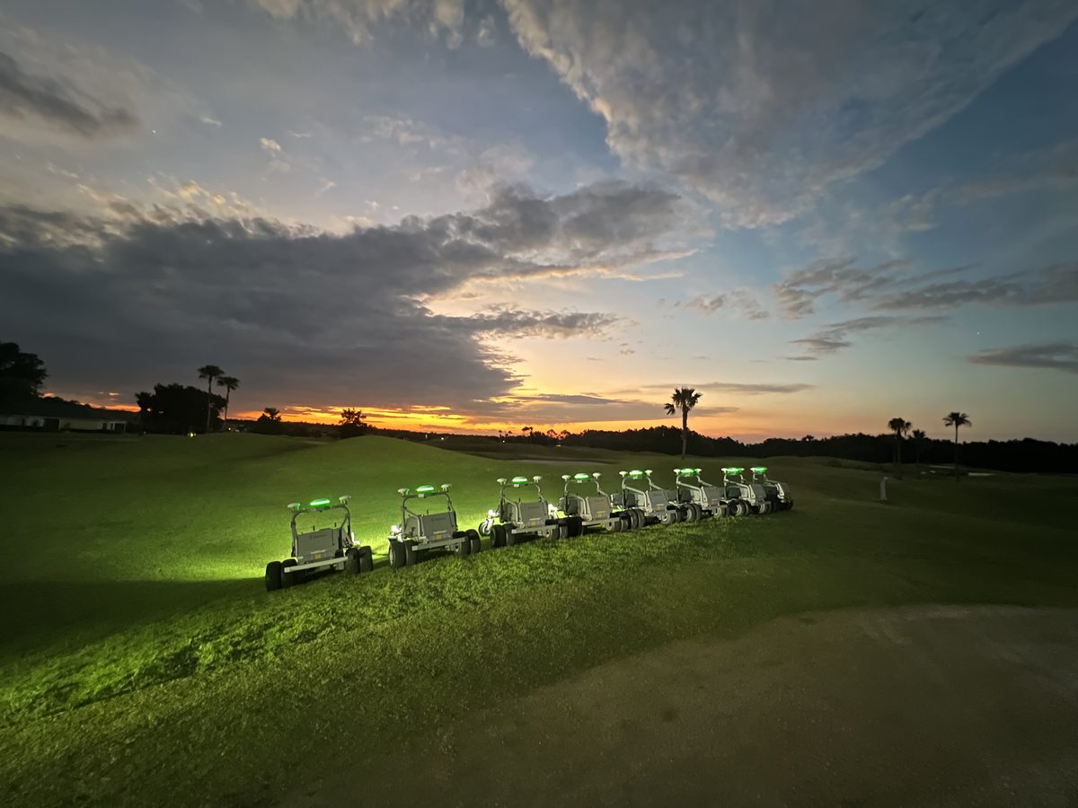 The RM21 fleet lit green on a slope at LPGA International at dusk